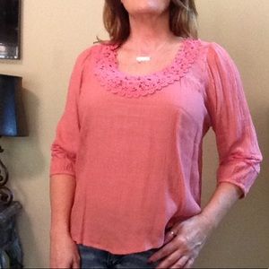 Salmon colored blouse with 3/4 length sleeve's.