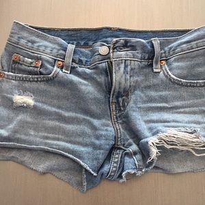 Short shorts with rips on thigh