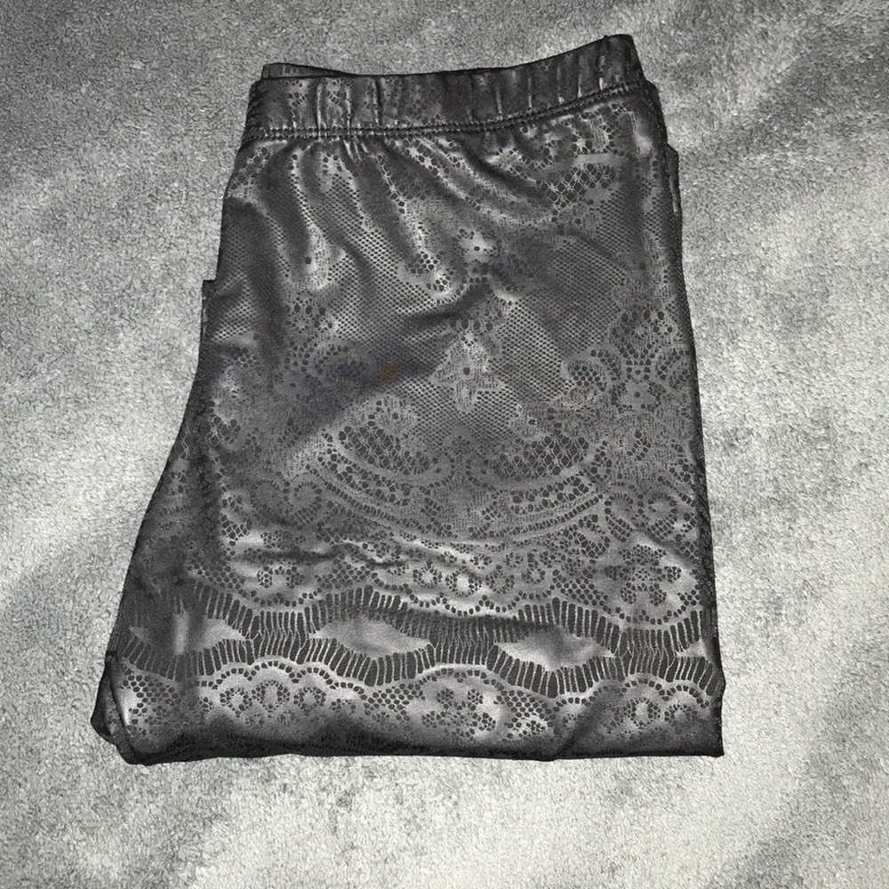 Lace patterned leather leggings