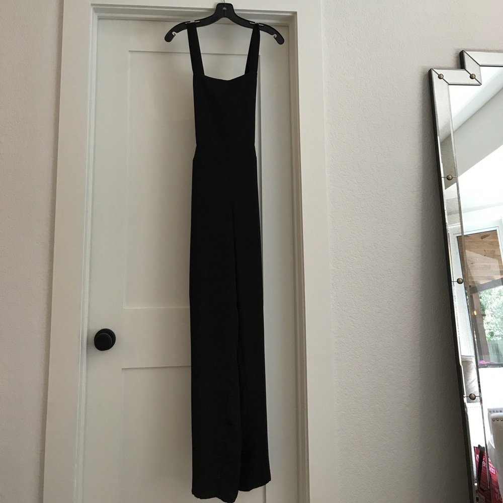 Black jumper/overall with criss cross in the back!