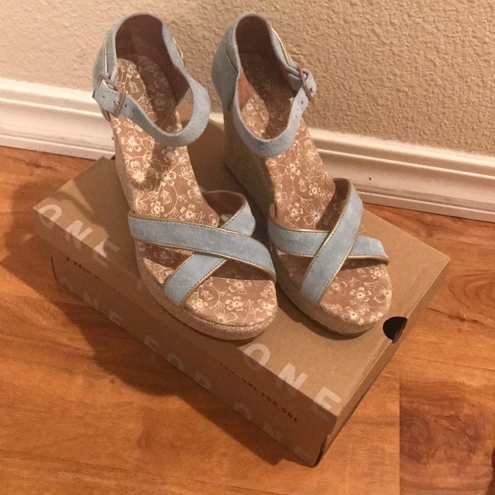Brand new, never worn Toms blue strappy wedges!