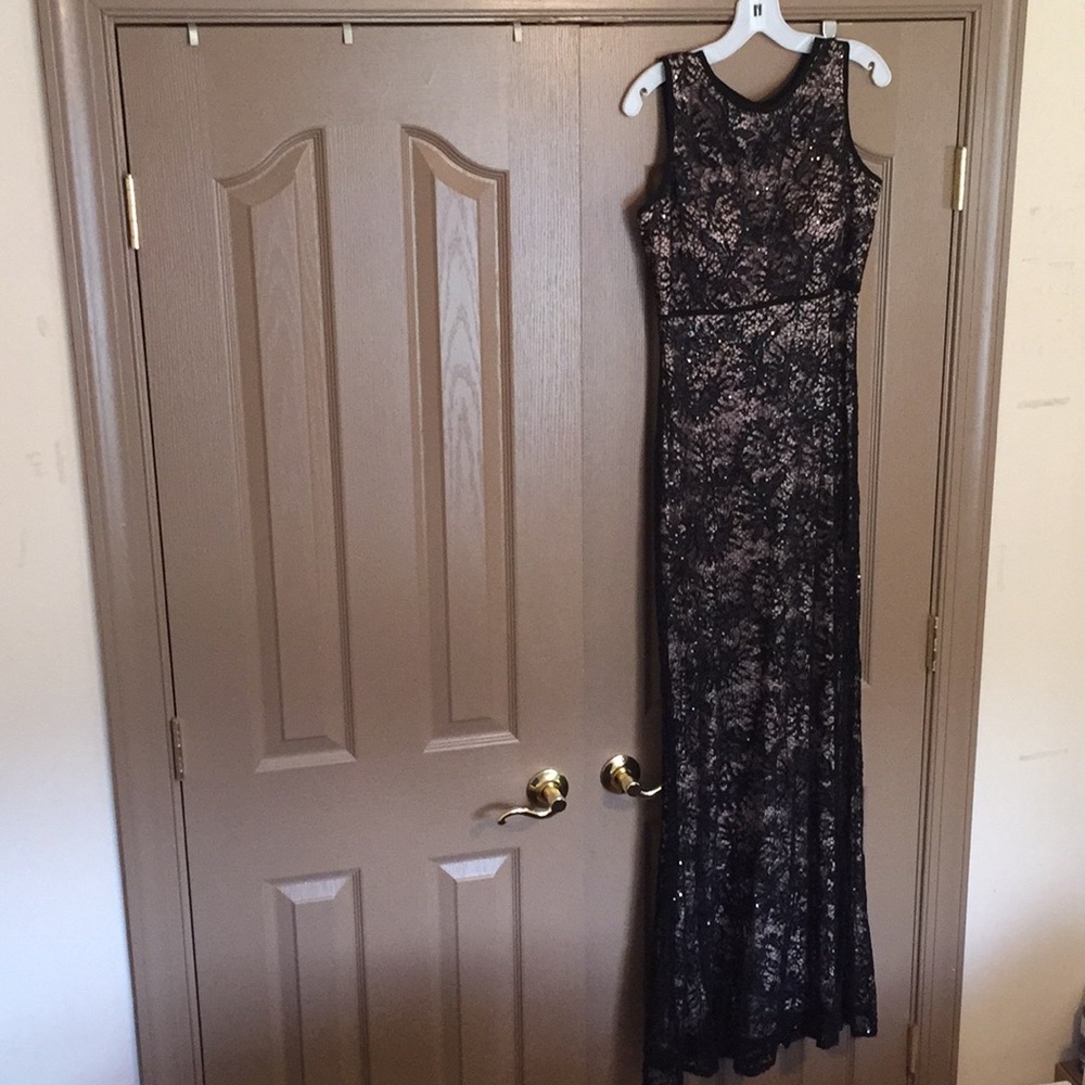 Formal floor length sleeveless keyhole dress