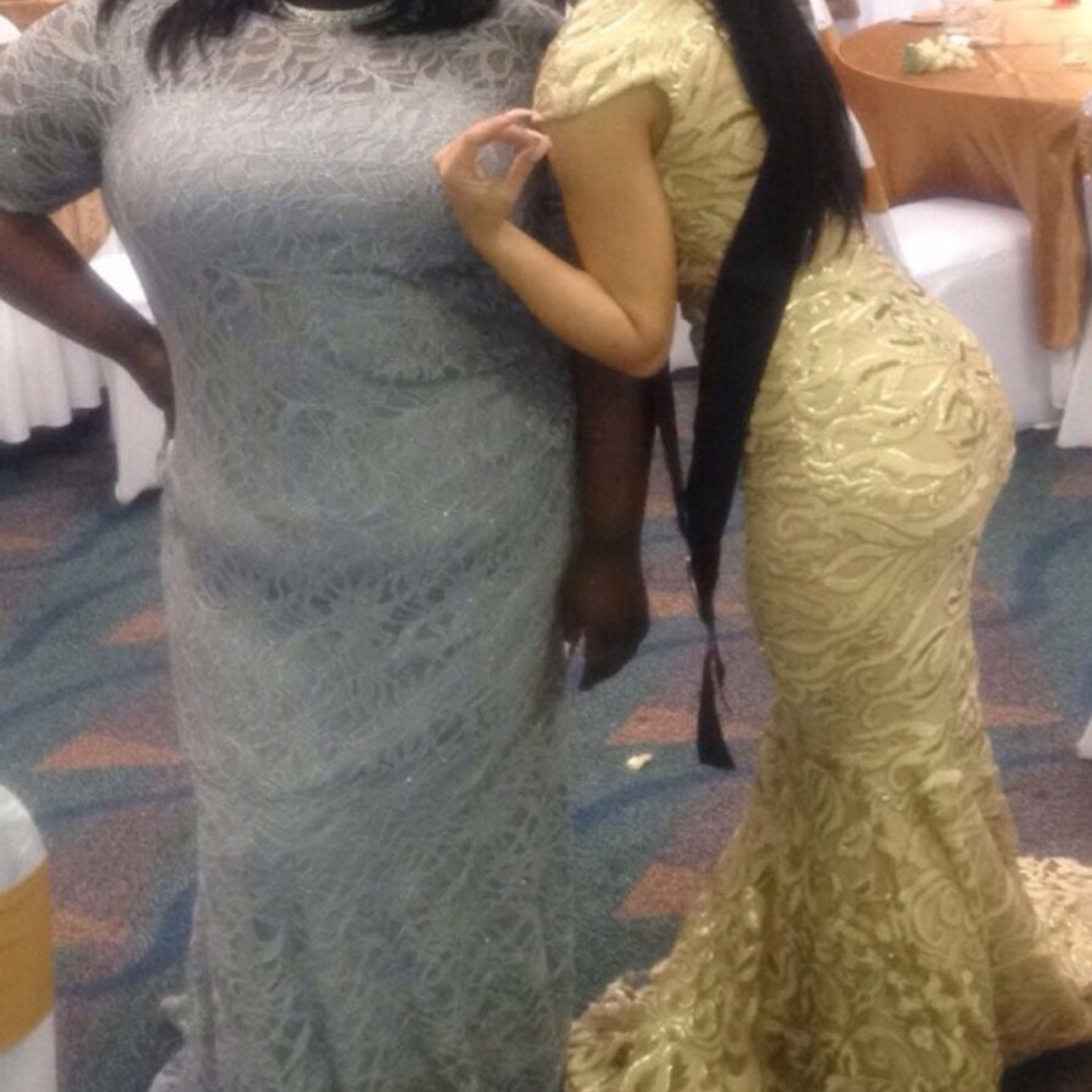 Dark gray elegant prom dress on the left.