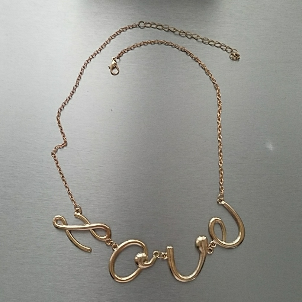 Gold colored "Love" cursive necklace