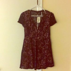 Black dress with lace overlay.