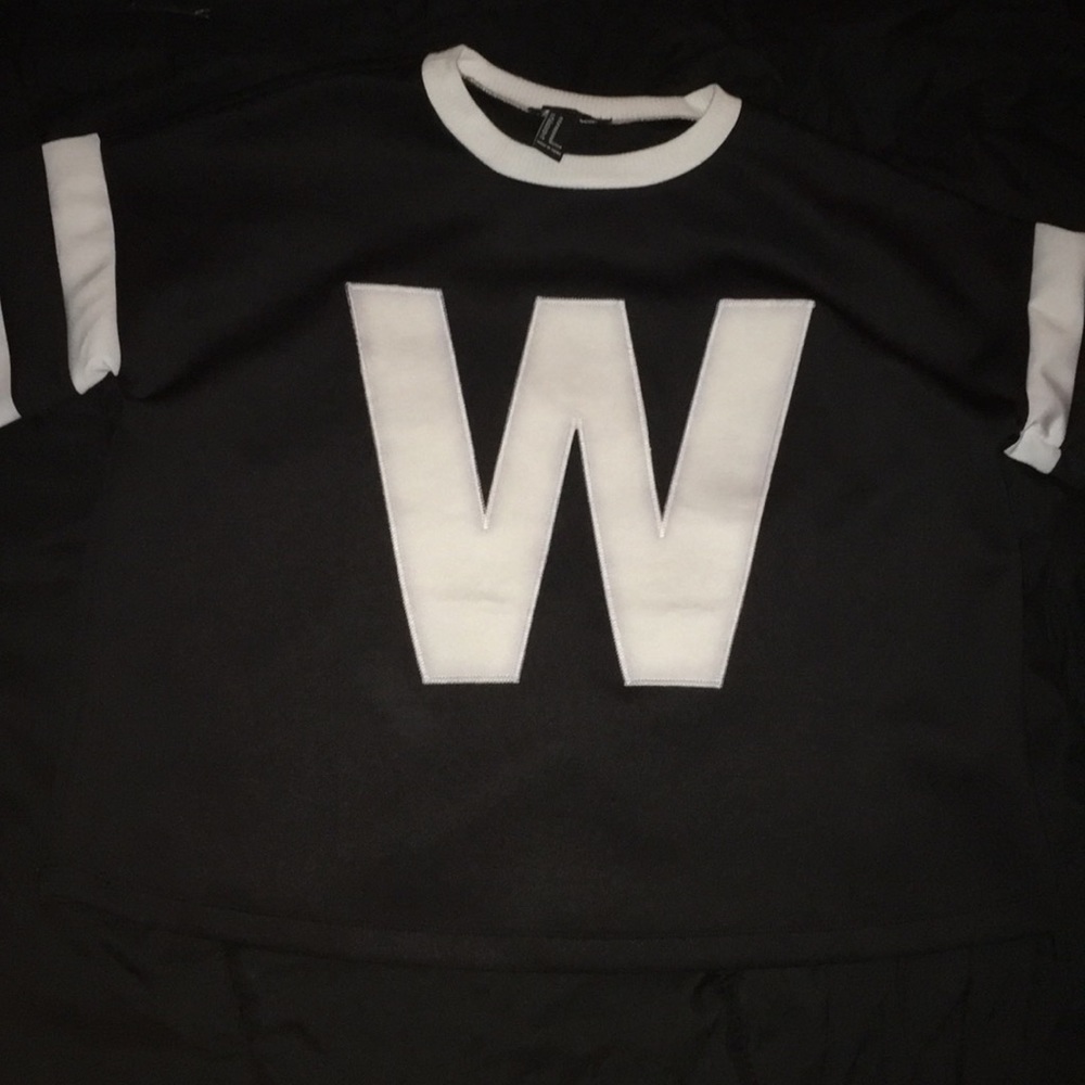 Black top with white neckline and sleeves