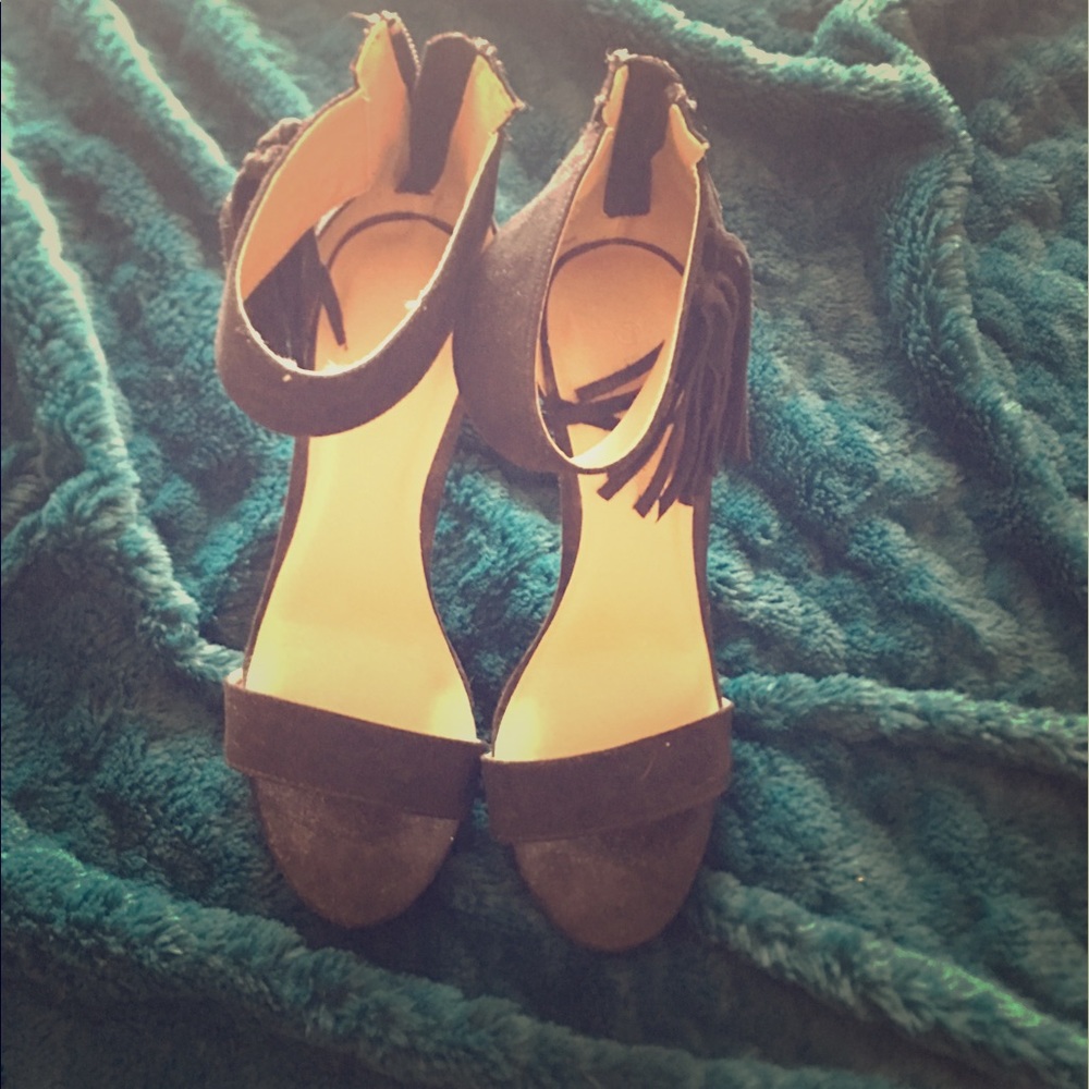 Ankle strapped heels with fringe.