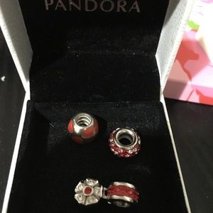 SOLD Pandora red bracelet charms with boxes.