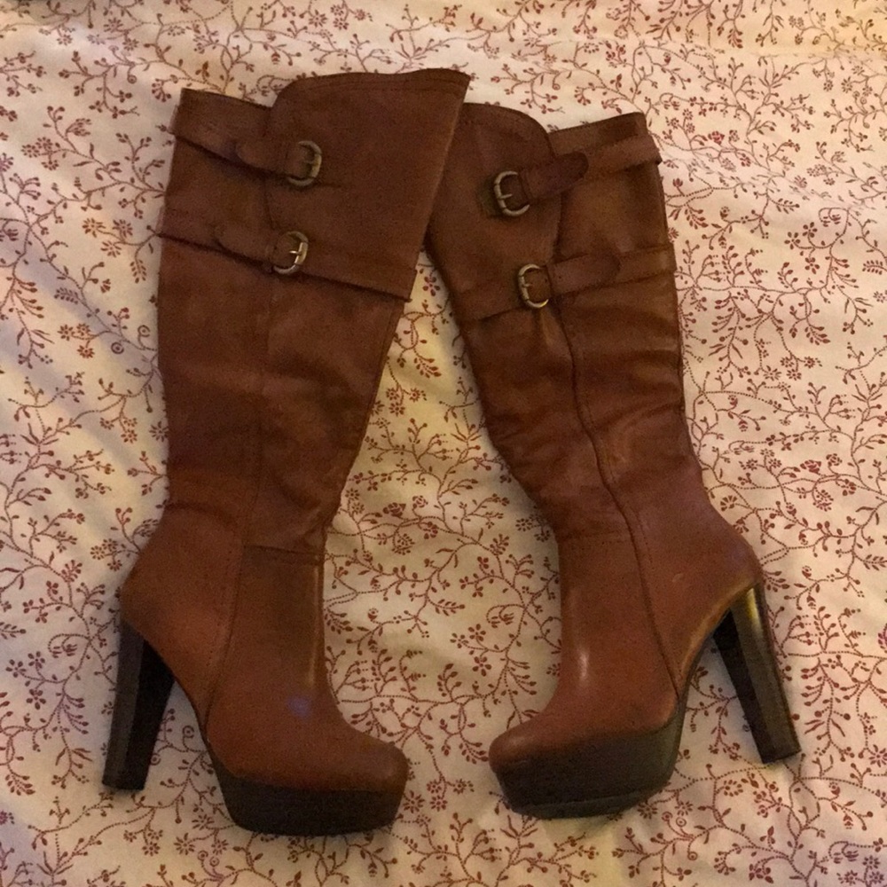Knee high camel color boots.