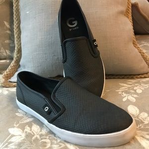 Guess black slip ons