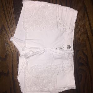 White jean shorts with lace detail