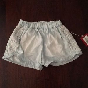 Blue flowy shorts with lace detailing