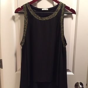 Cute top with gold trimmings!