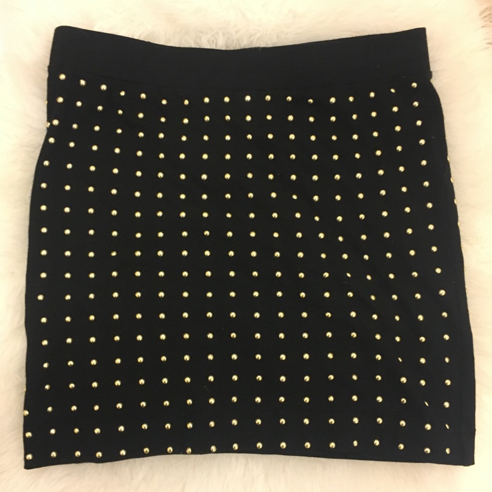 Large black body con skirt with gold grommet/studs