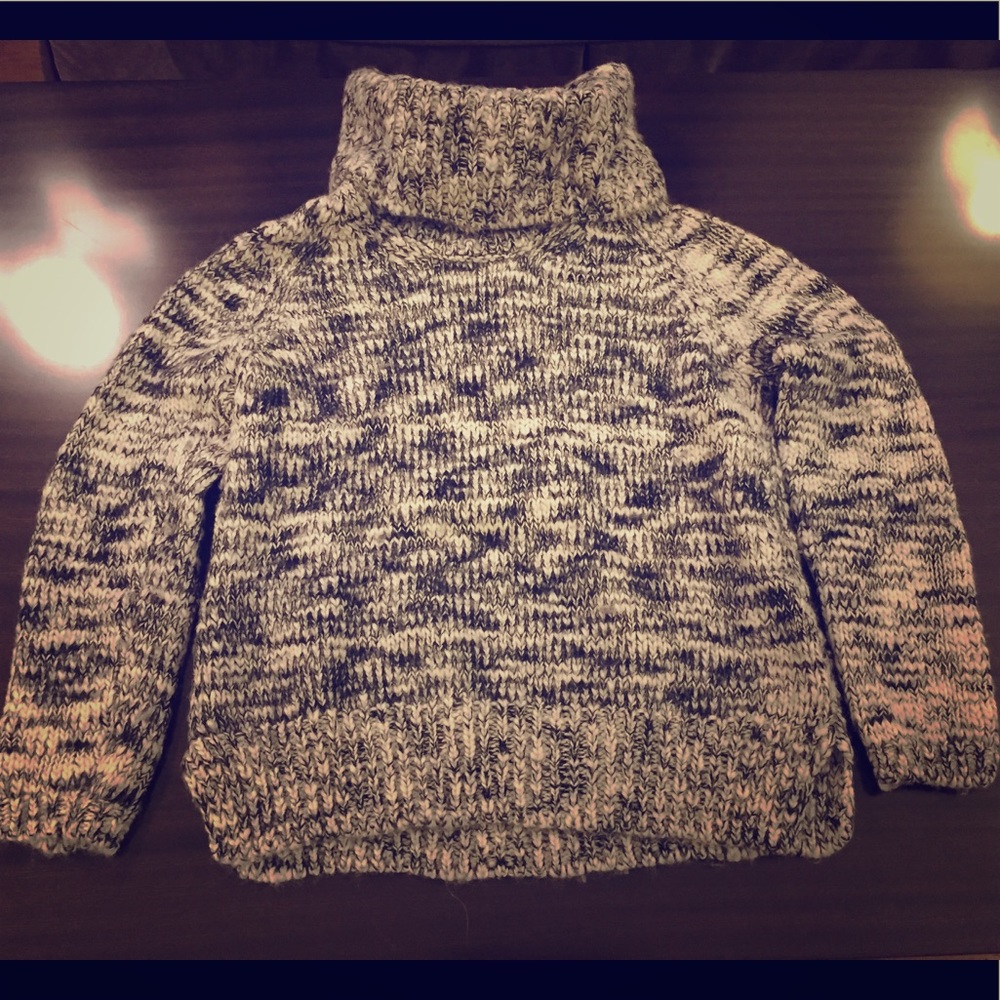 Turtle neck sweater.