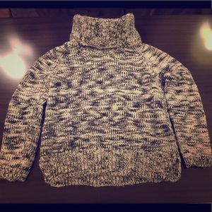 Turtle neck sweater.