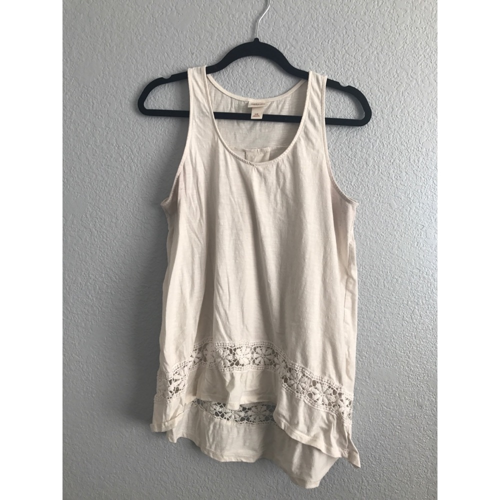 Cream tank with lace detailing at bottom