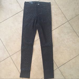 Coated black w/ cheetah printed design skinny jean