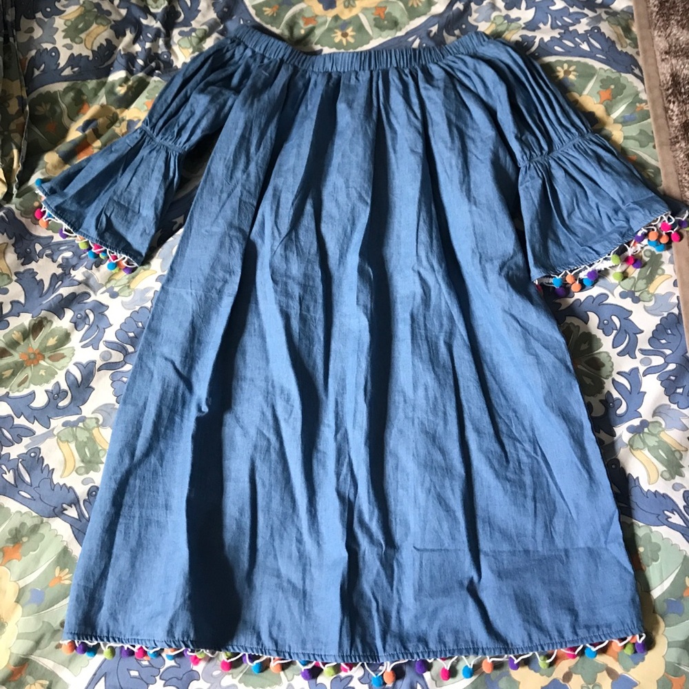 Super cute off the shoulder dress with Pom poms!