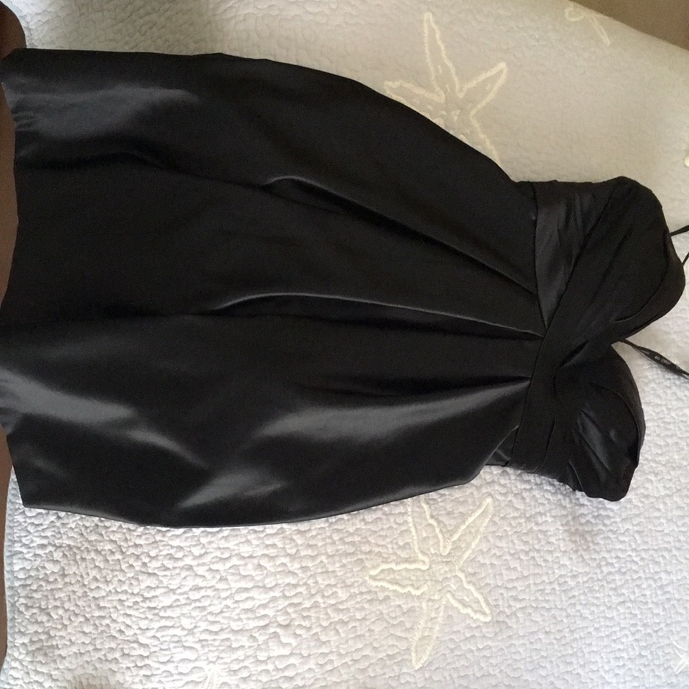 Black strapless silky dress.