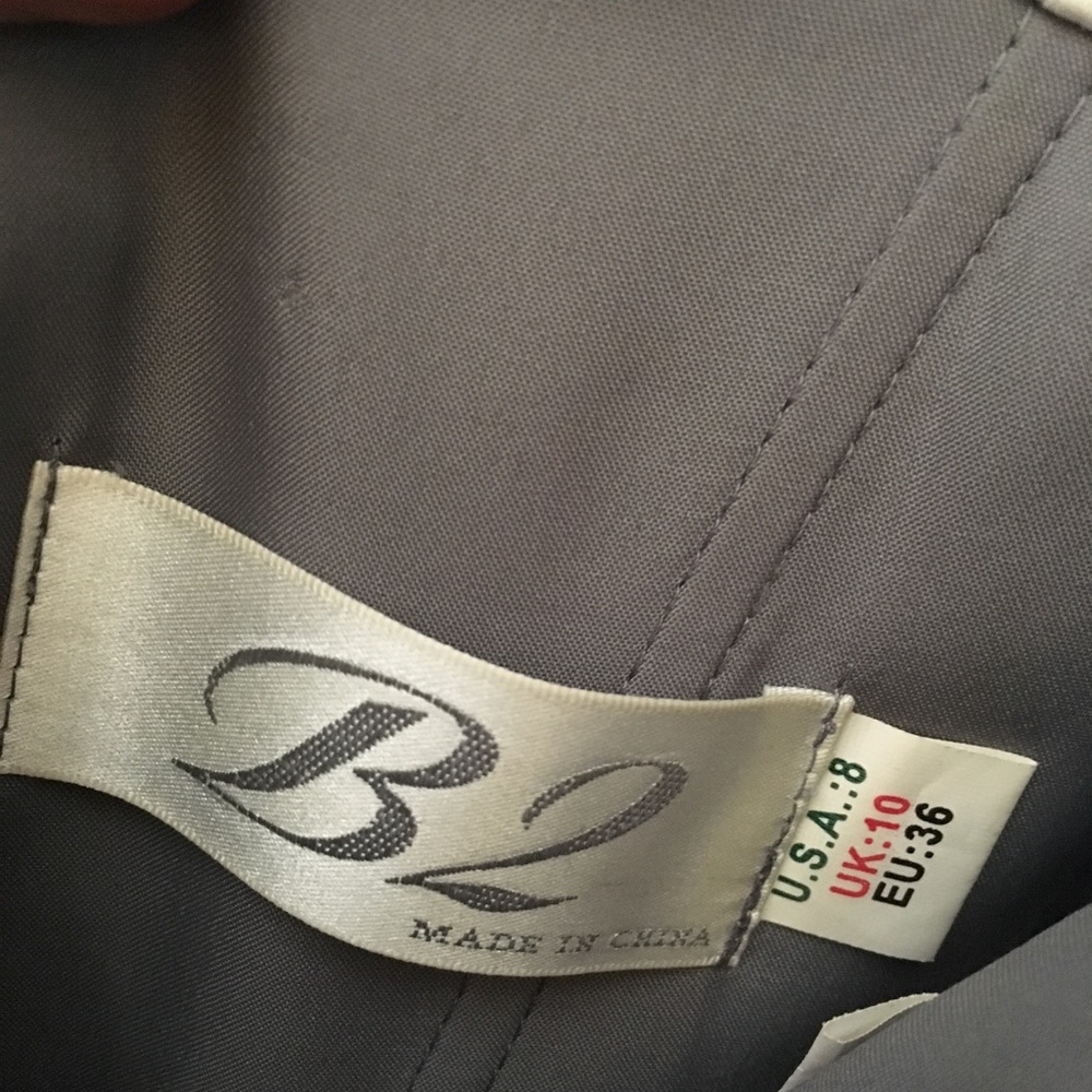 Grey tea length dress.
