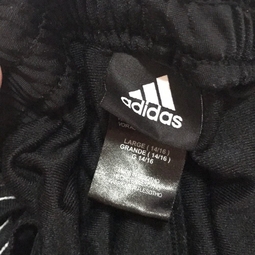 Adidas straight fit black 2 white strip pants.
