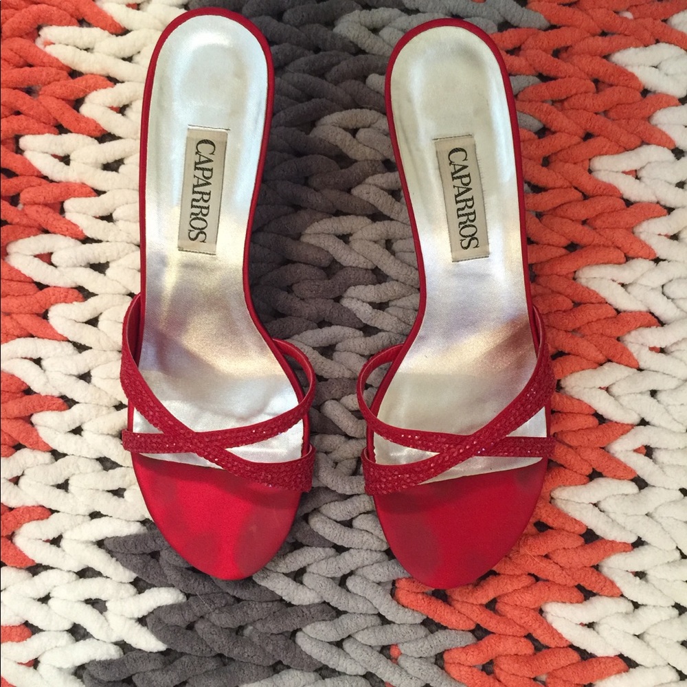Red heels with sequin accents. Caparros brand.