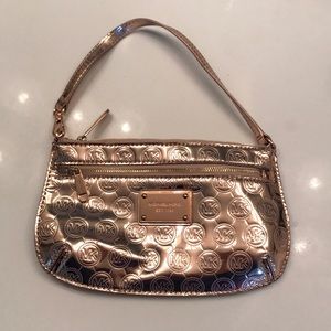 Rose gold metallic Michael Kors wristlet