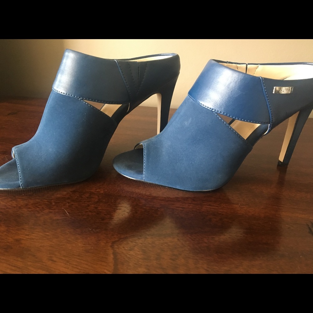 Calvin Klein mules.