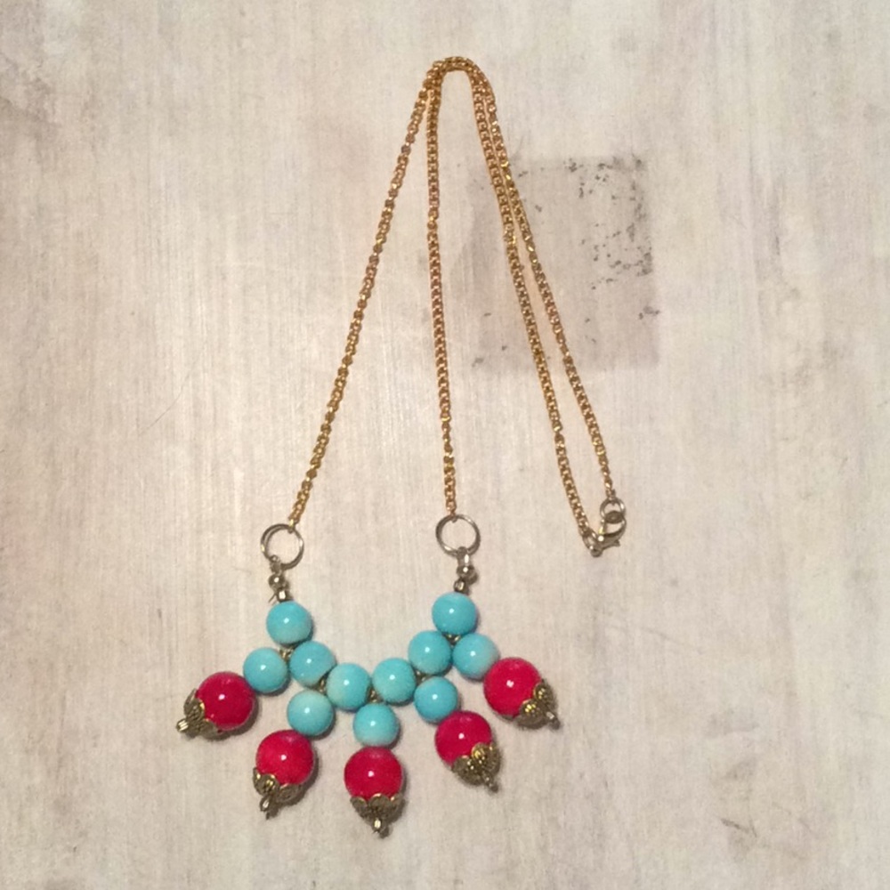 Light blue and red necklace.