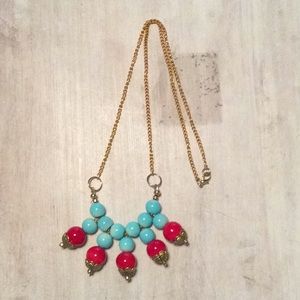 Light blue and red necklace.