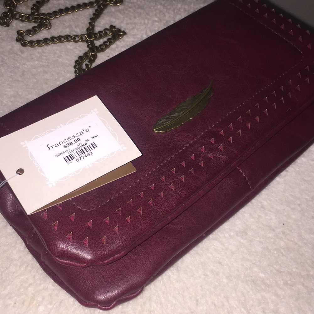 Burgundy clutch with gold chain, tag on!