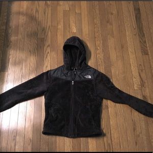Black fuzzy fleece North Face jacket with hood