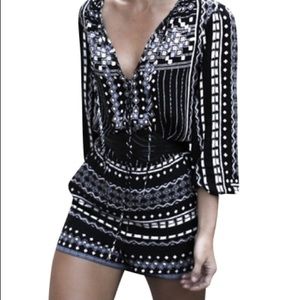 Chic geometric print lace-up front romper