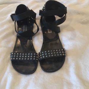 Studded black Steve Madden gladiator sandals.