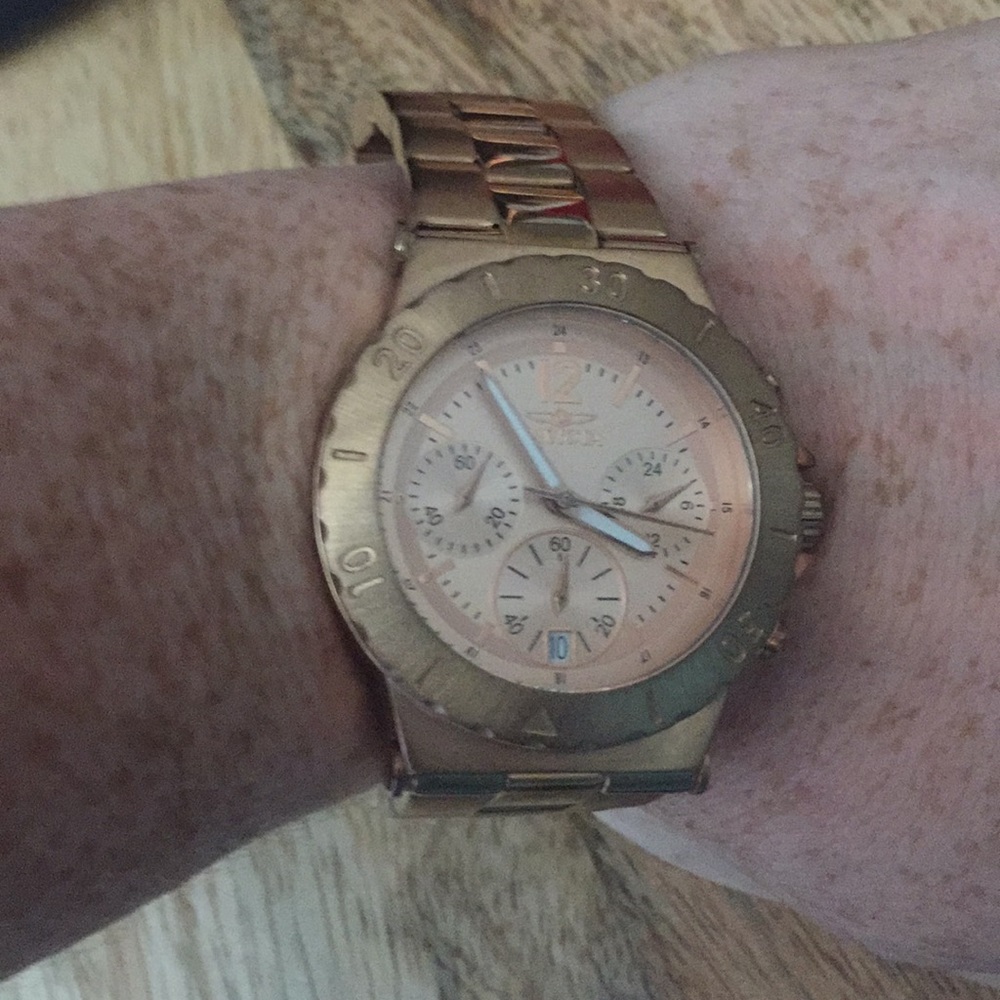 Invicta rose gold watch.