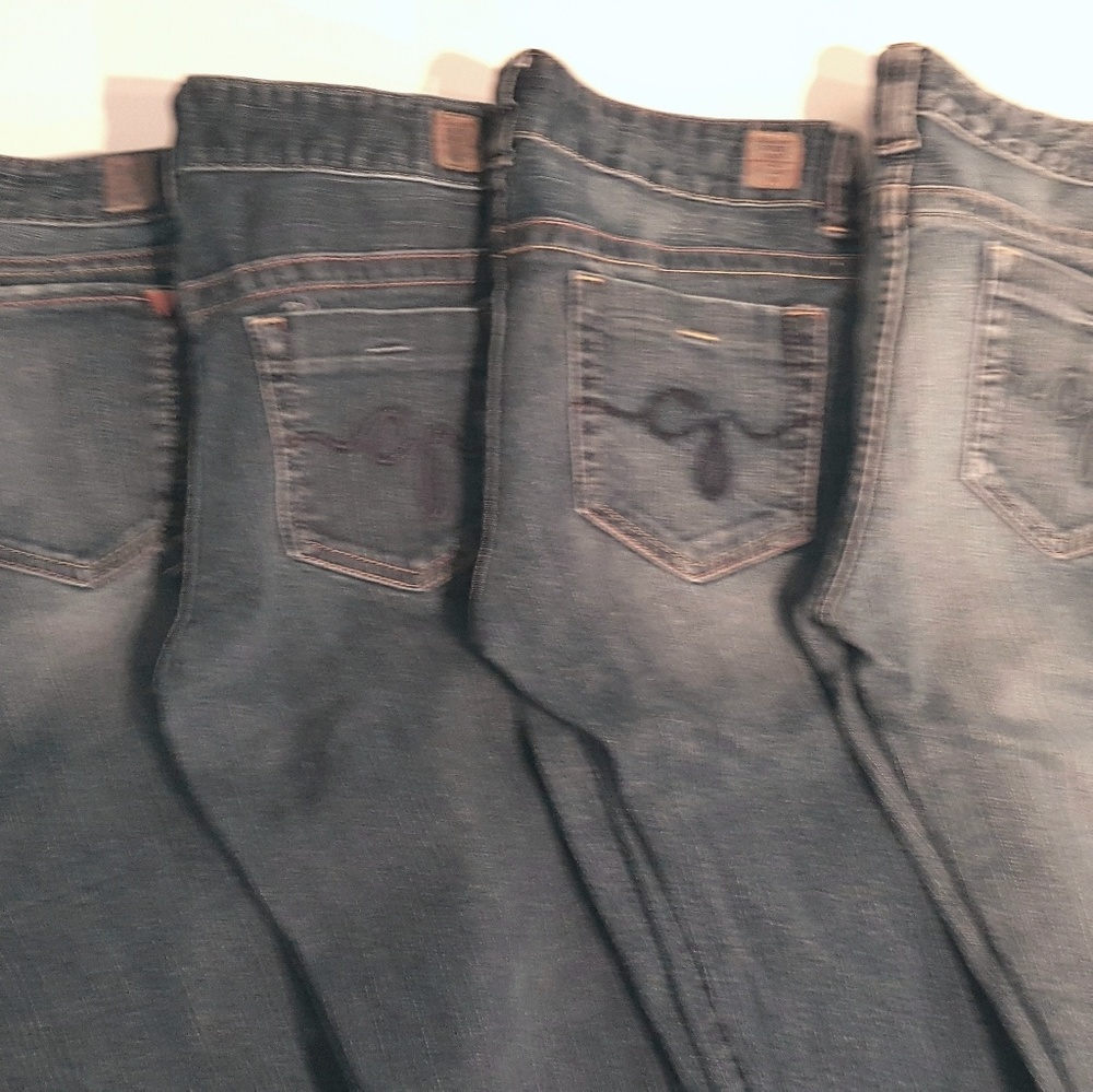 Four pairs of Guess jeans
