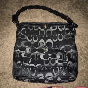 Black coach over the shoulder.