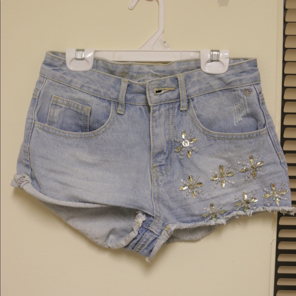 Flower bejeweled jean shorts