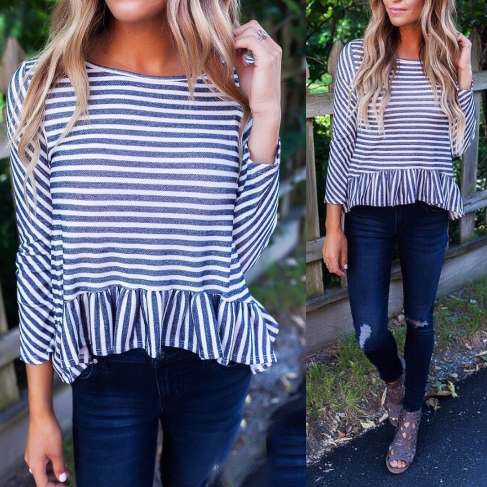 Navy & white striped top with ruffle hem detail.
