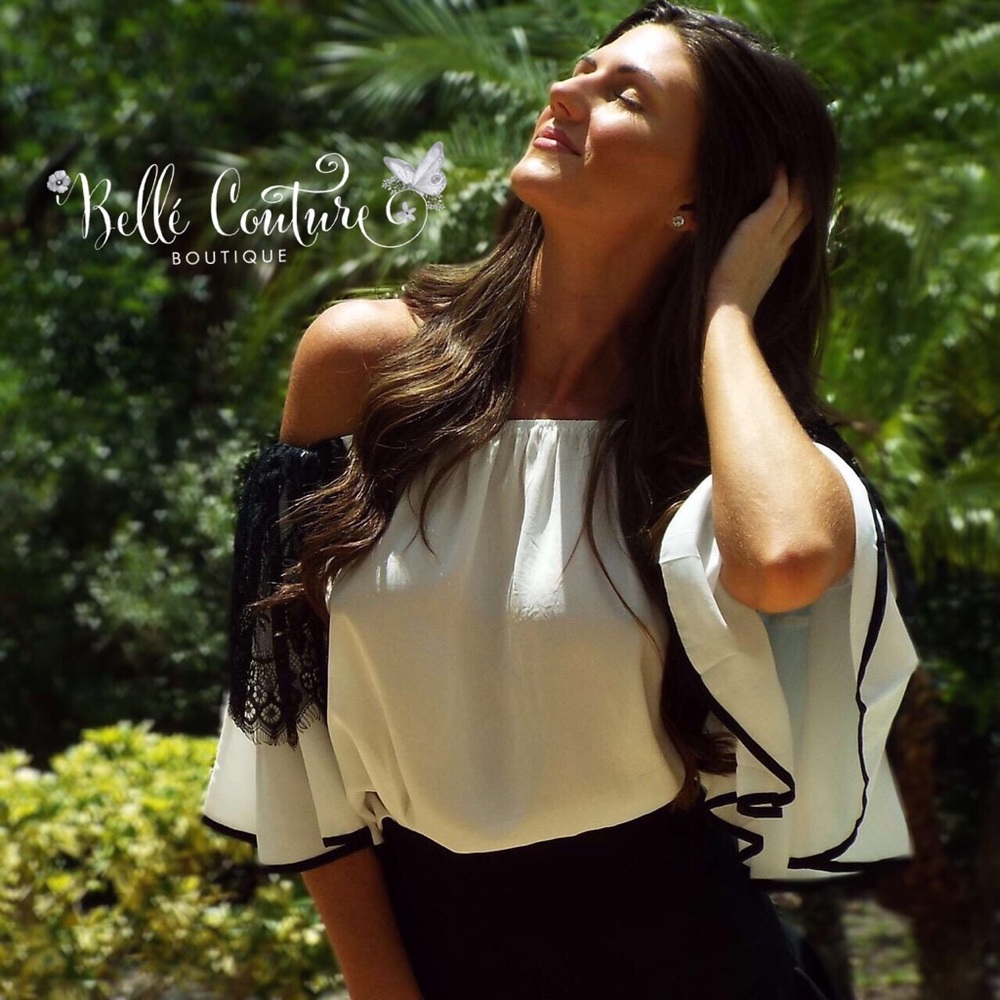 Off the shoulder top with black lace bell sleeves.