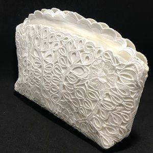 Embroidered cut out purse