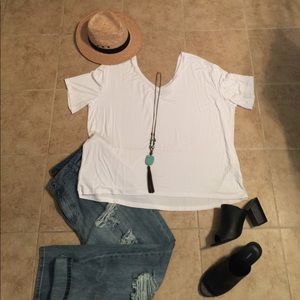 Fun and stylish White Piko top