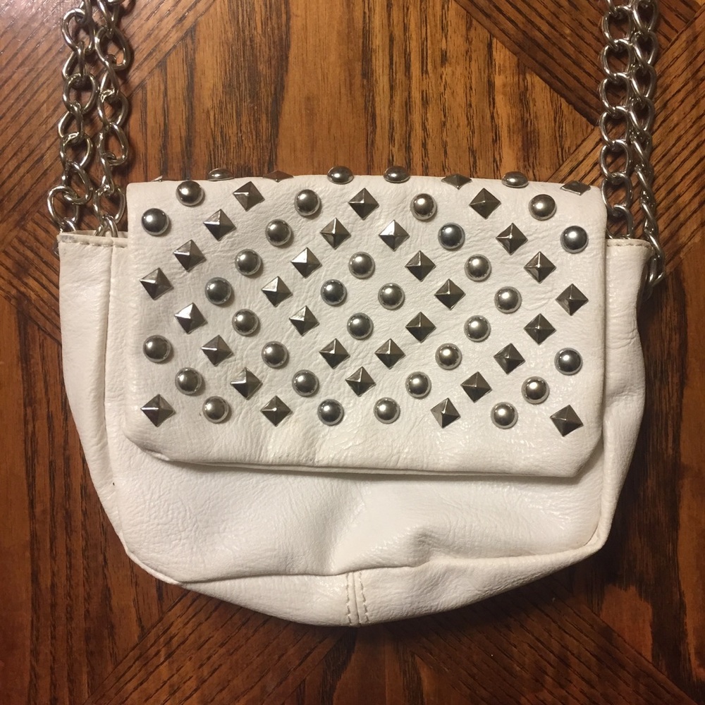Small white cross body bag with studded front flap