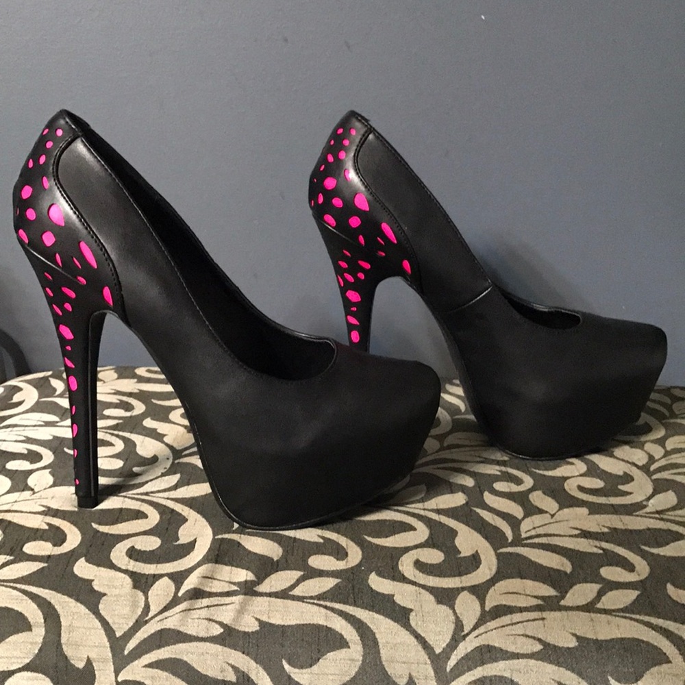 Tall platform with black and pink accented heel.