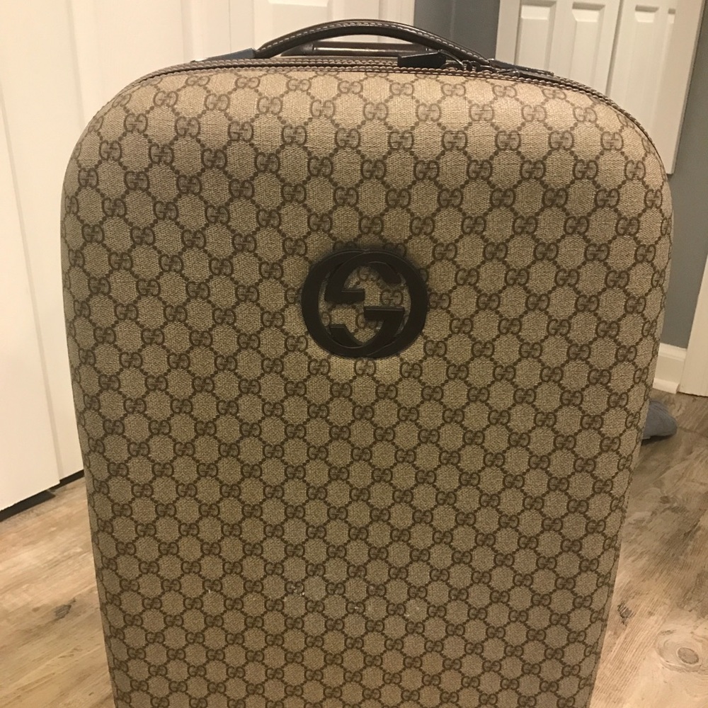 Gucci carry on rolling luggage