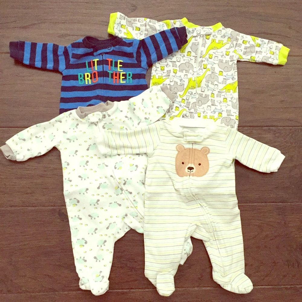 Carter's Newborn size,  zip up jam jams. 4 pairs.