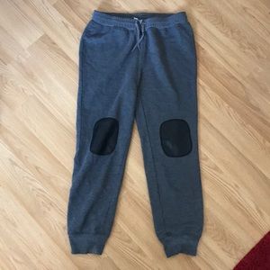 Gray sweat pants with faux leather detail