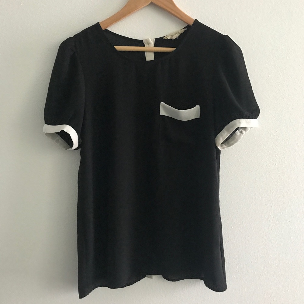 Black and white tee with buttons down the back