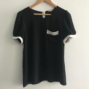 Black and white tee with buttons down the back